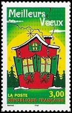 Maison rouge aux volets verts